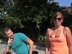 Hot sexy brunette milf shows her big boobs in living room