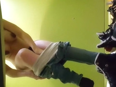 Pregnant girl strips out of her clothes in the changing booth