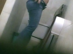 Big booty brunette babe pissing in the toilet