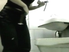 Amateur girls lift up coats and sit pissing on toilet
