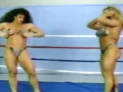 name the muscle wrestling/catfight video company 34