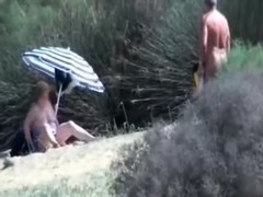 Pervert granny masturbates in front of stranger at beach
